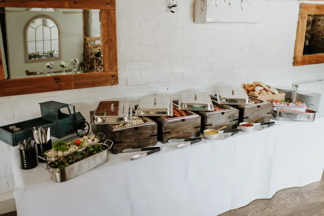 A buffet table set out with chafing dishes