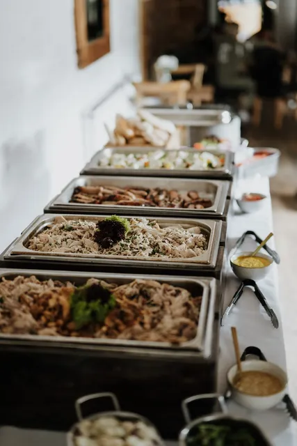 Rice dishes lined up along the buffet