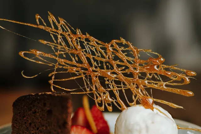 Spun sugar work over a dessert