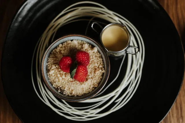 A crumble with a jug of custard