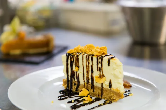 A cheesecake slice with chocolate sauce