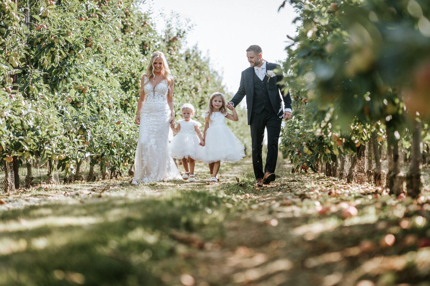 Newlyweds among the apple trees