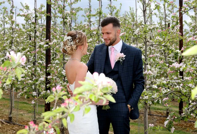 A couple among the blossom in spring