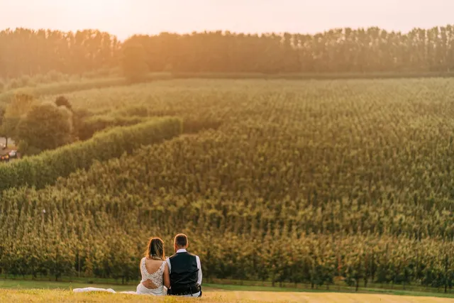 A couple sitting together overlooking the fields