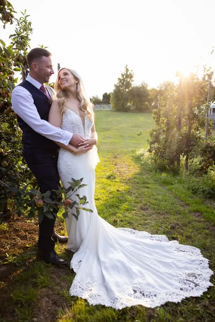 A couple in the long grass at golden hour