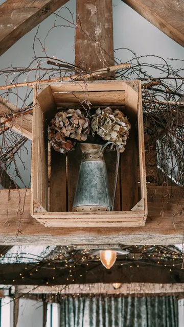 A dried hydrangea arrangement in a zinc jug at The Roost