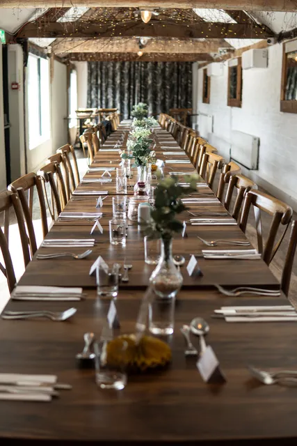 The Roost's long banquet table set for a group
