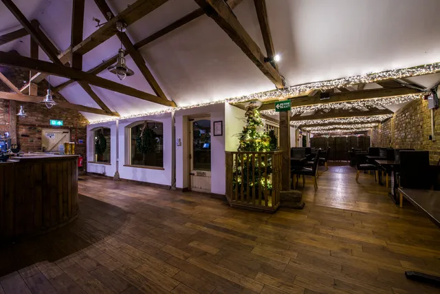 The Roost's oak beams and fairy lights overhead