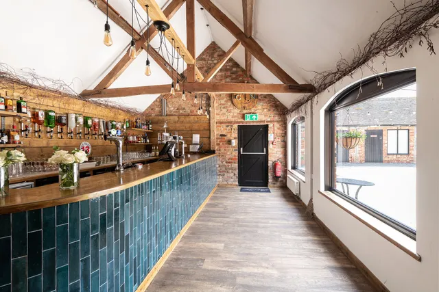 The bar at The Roost with its teal tiled front