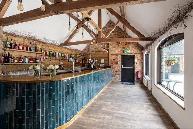 The length of The Roost's bar beneath the beams