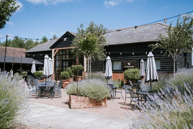 The Rooster's lavender terrace with parasols and outdoor seating