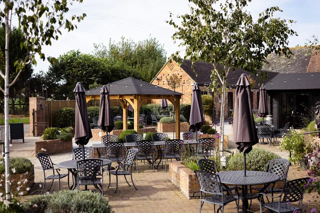 Terrace seating and the gazebo outside The Rooster