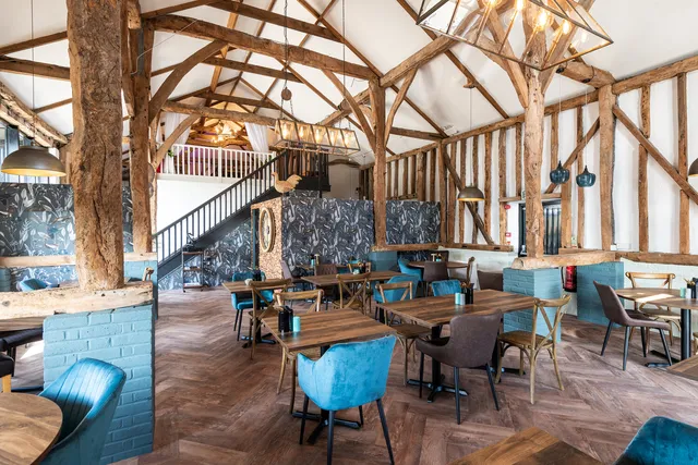 The oak-framed dining room at The Rooster with the gallery above