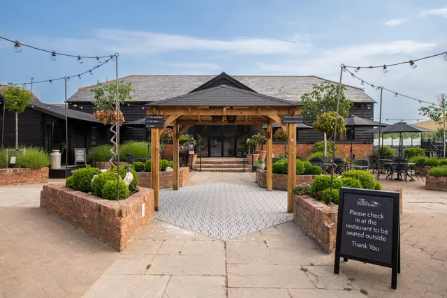 The oak pergola over the path into the Courtyard