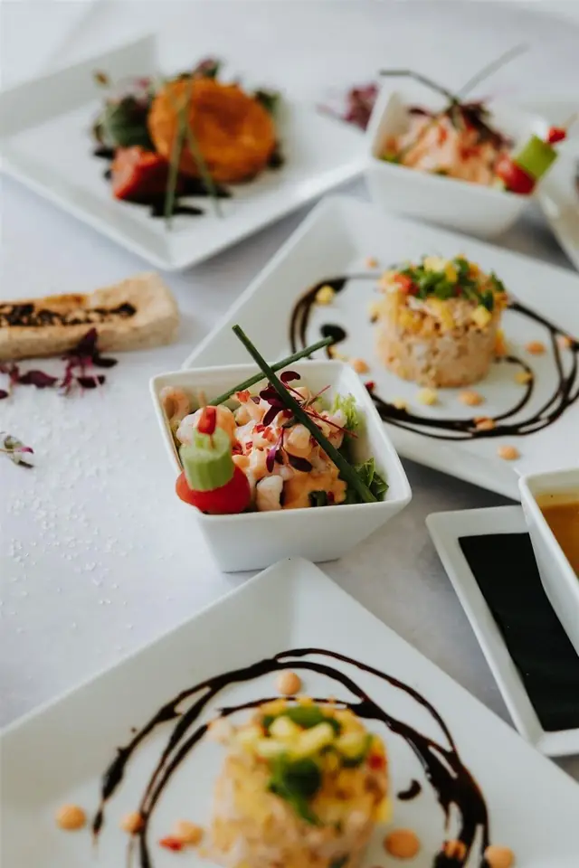 A stacked main course garnished and ready to serve