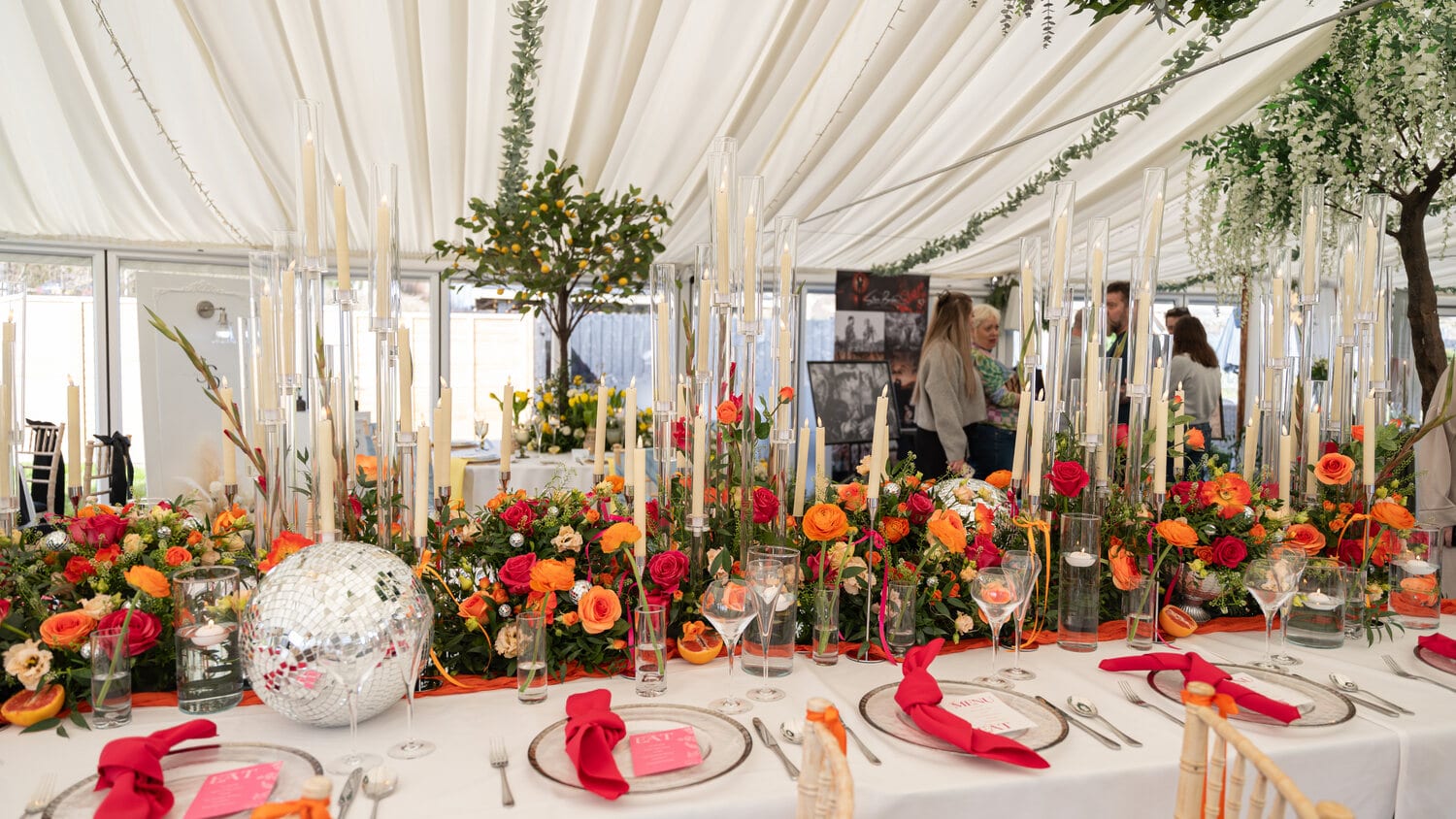 A long table dressed with flowers for the wedding breakfast