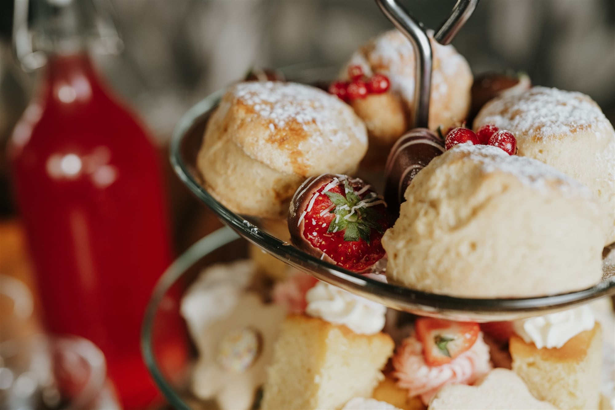 A tiered afternoon tea stand at The BarnYard with scones, cakes and homemade lemonade