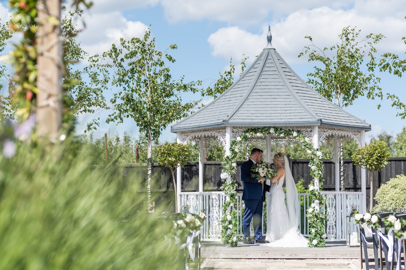 A couple at the ceremony gazebo at The BarnYard during their civil ceremony