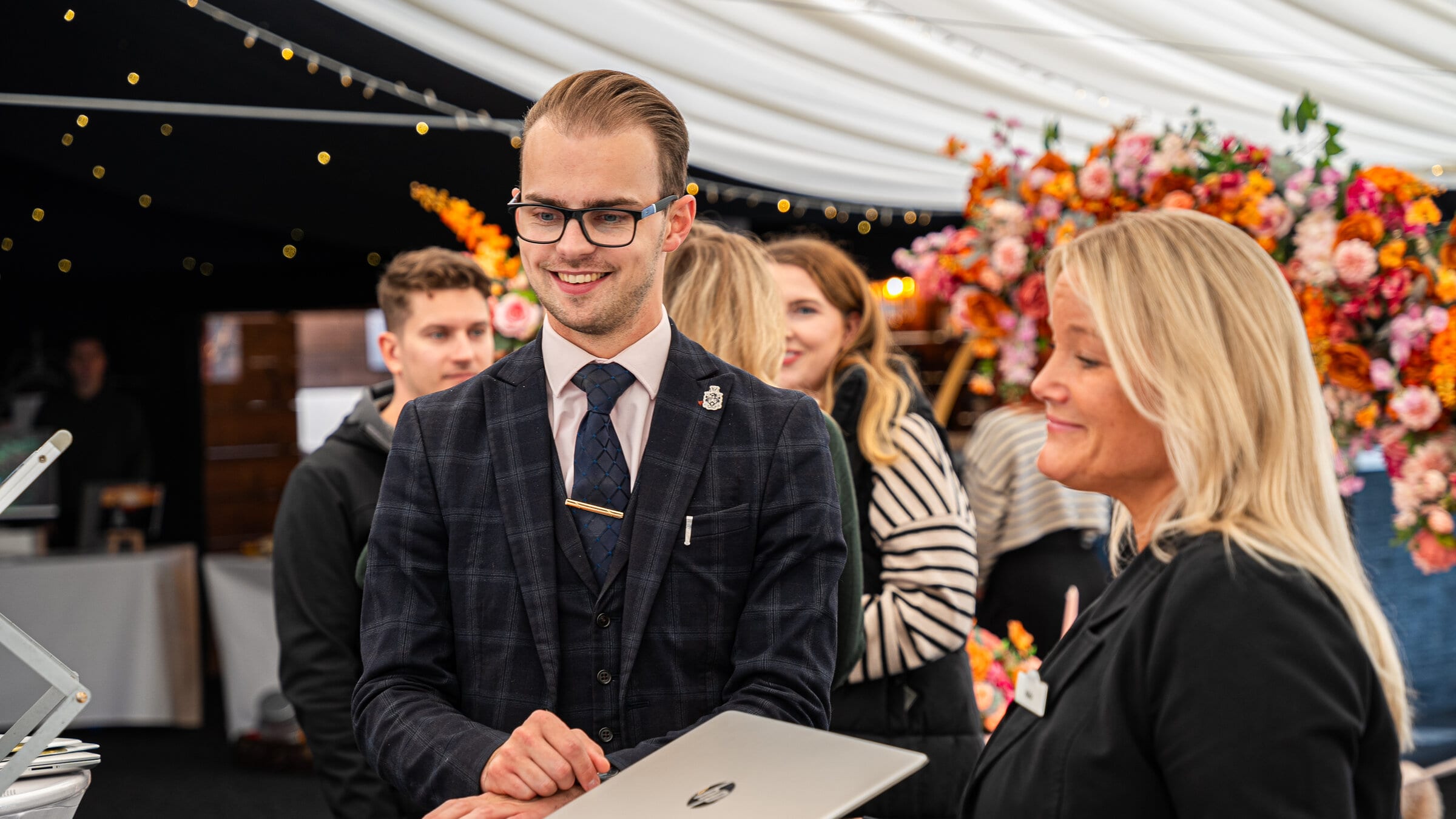 A BarnYard coordinator helping a couple at a wedding open day in Kent