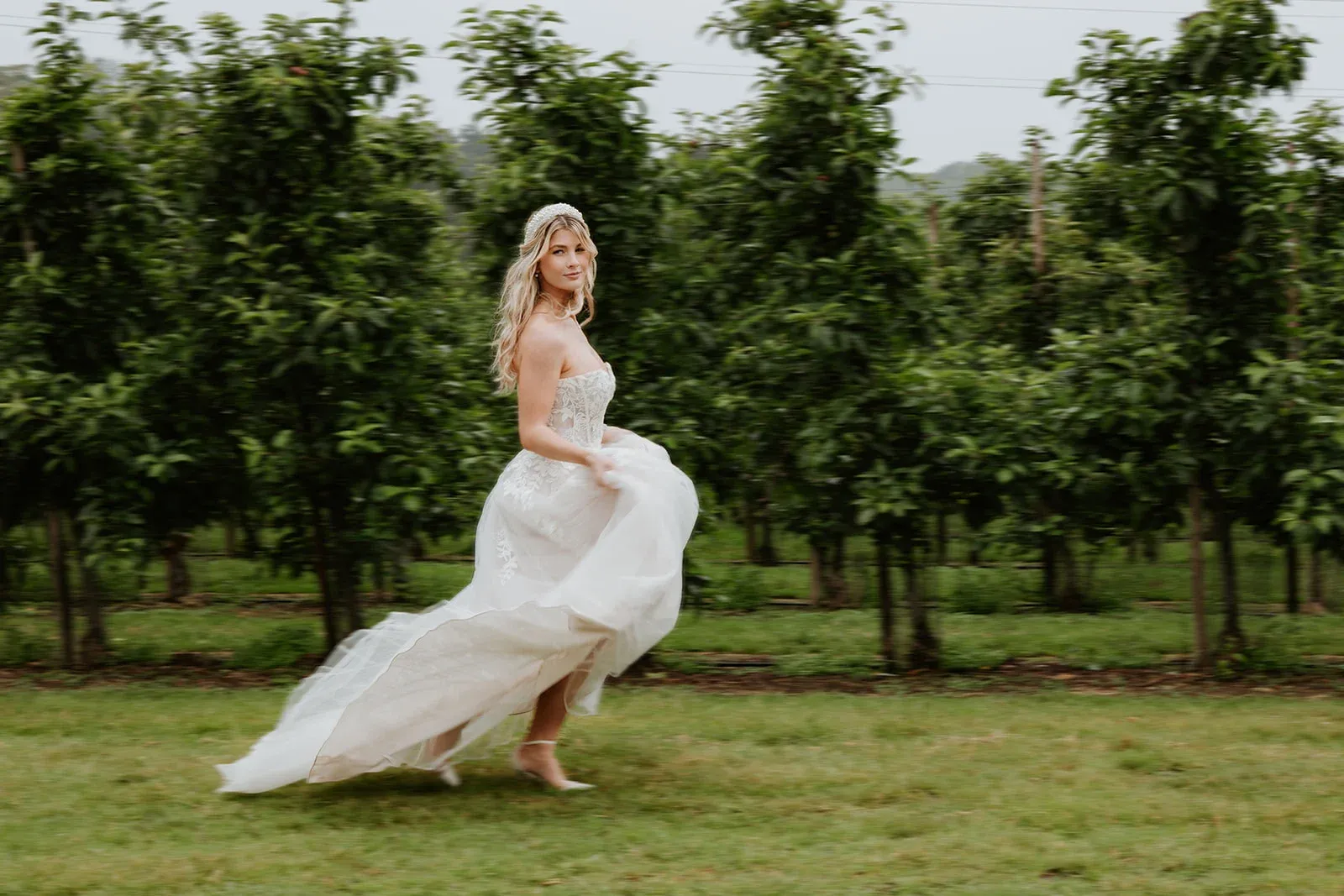 A bride in the orchard at The BarnYard