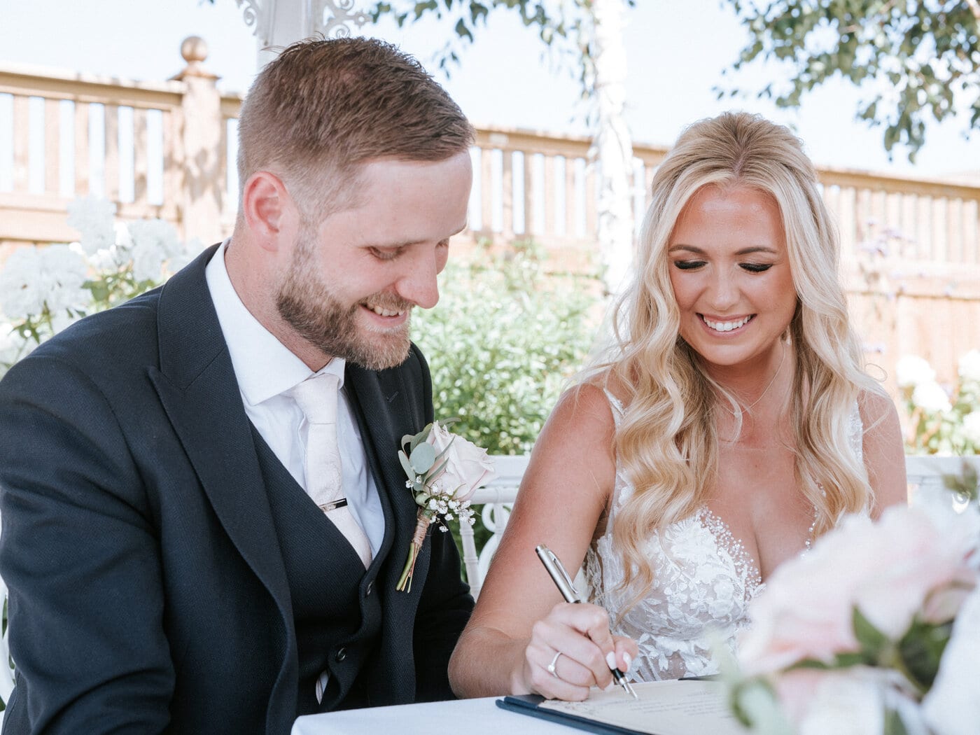 A happy couple together on their wedding day at The BarnYard